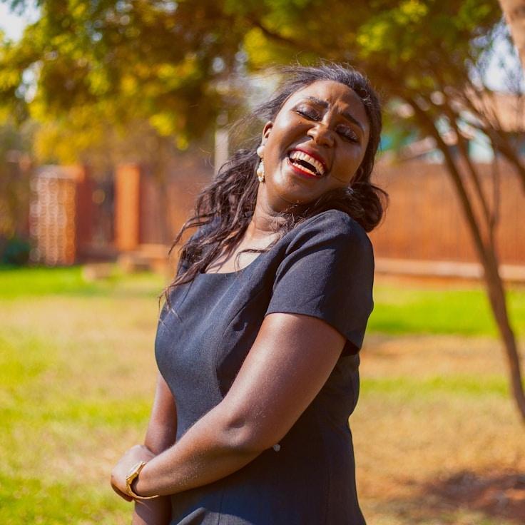 Kaveri Mehta, Lead Design Curator at AureliaNovaFlora, reviewing corporate floral arrangements